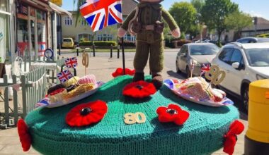 Someone knitted a special VE Day postbox cosy around my local shops