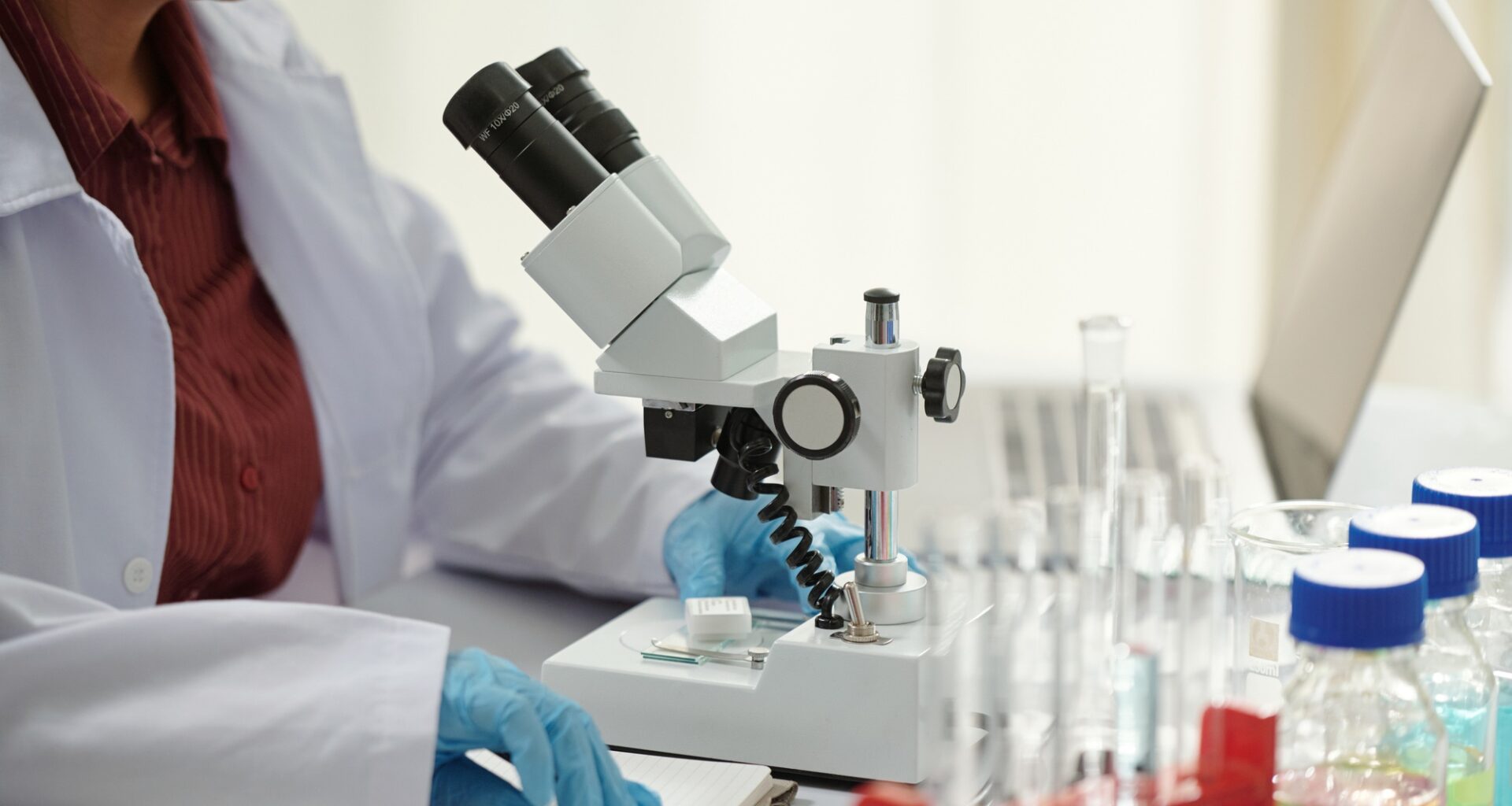 Pharmaceutical Scientist Working with Microscope