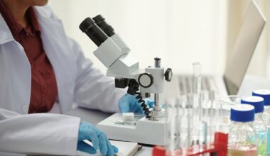 Pharmaceutical Scientist Working with Microscope