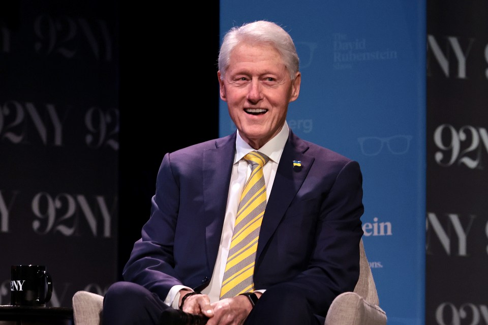 President Bill Clinton speaking onstage.