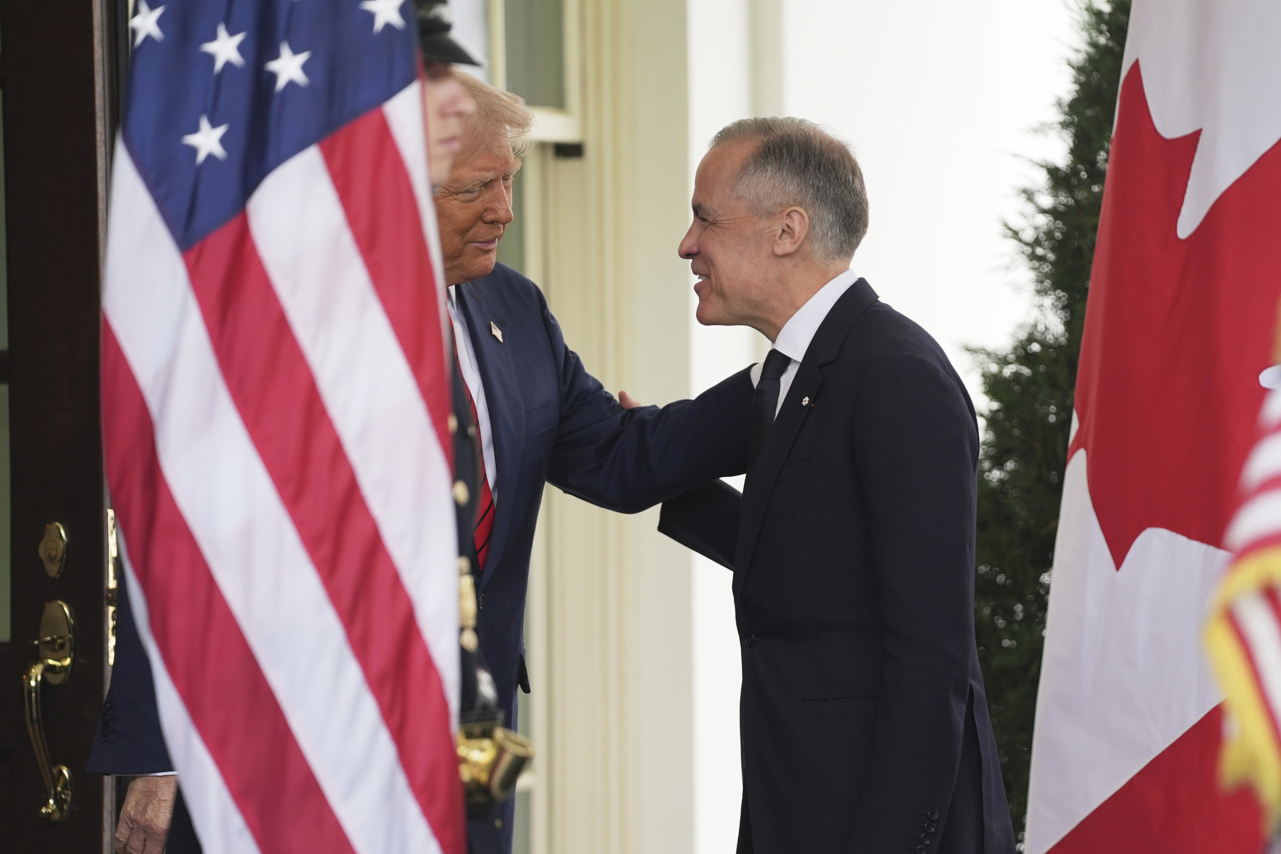 President Donald Trump greets Canadian Prime Minister 
