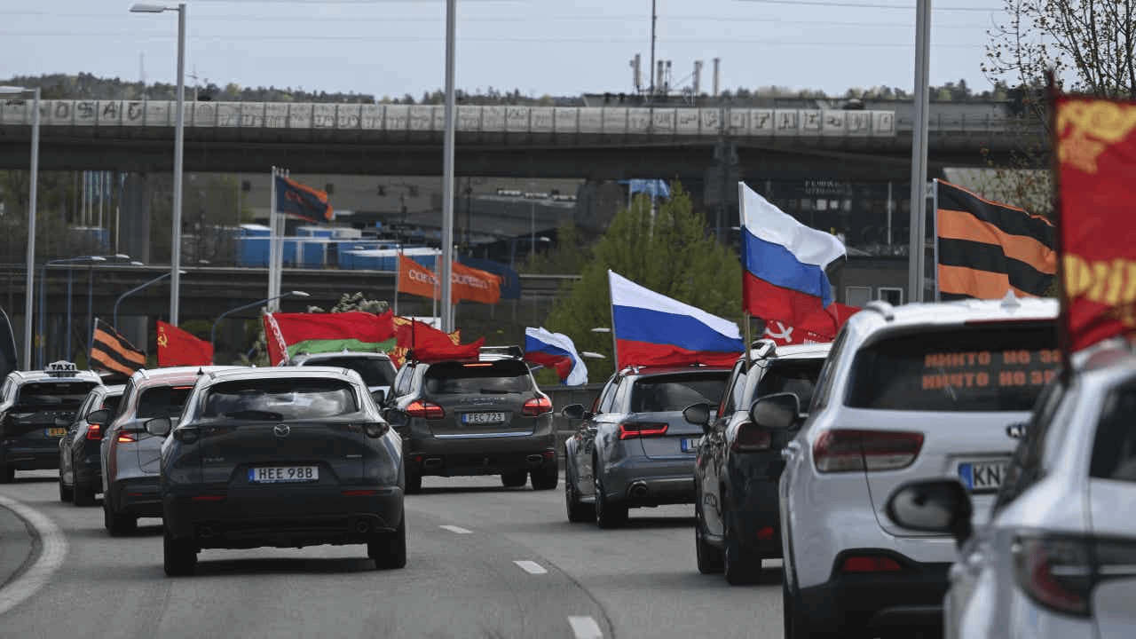 Russian immigrants parade in Sweden with flags