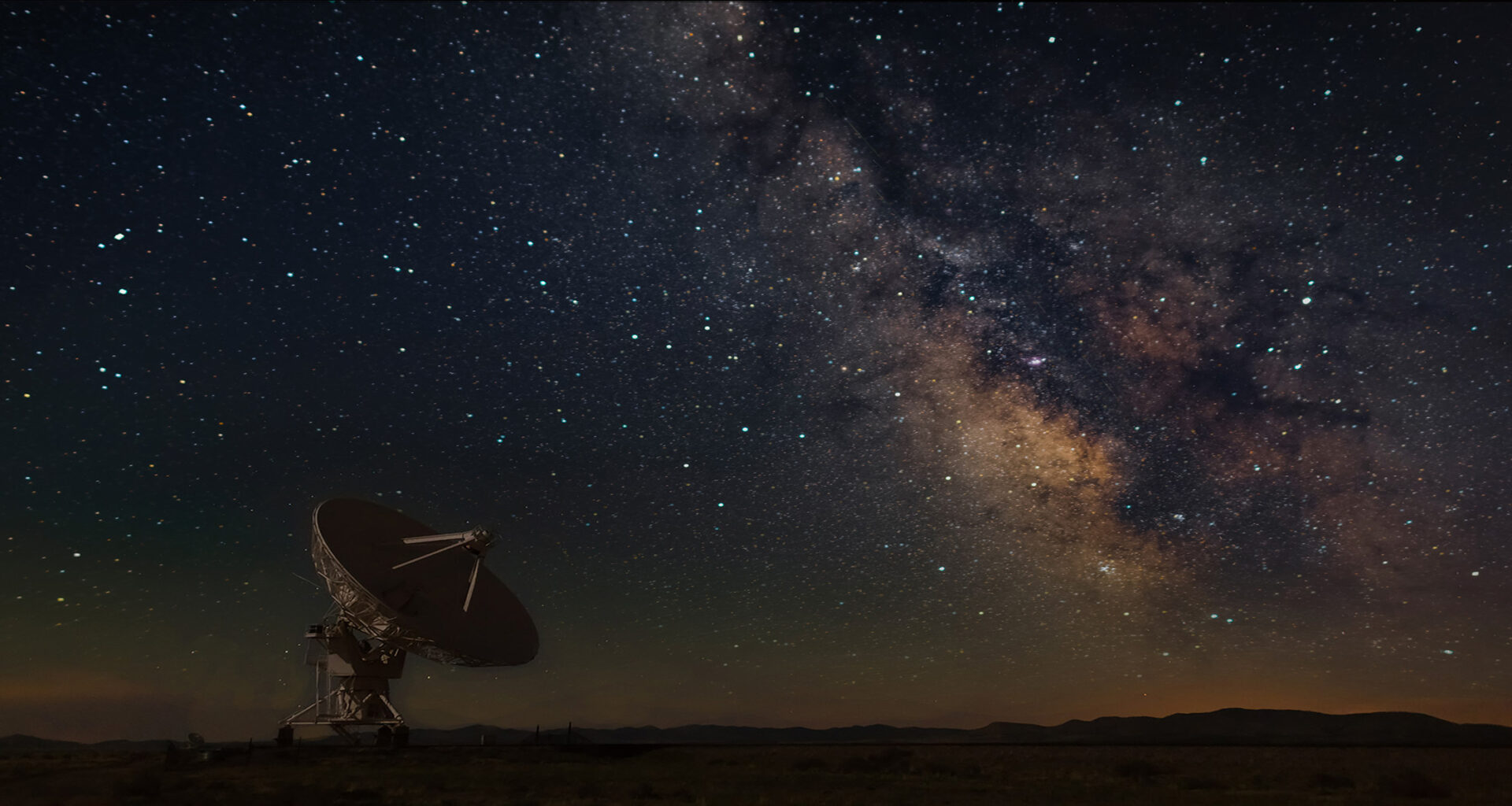 Satellite and dark sky with Milkyway