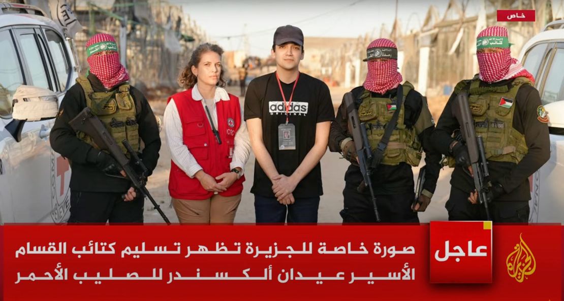 A photo from Al Jazeera shows Edan Alexander (center) during his Monday release.