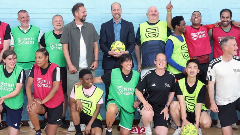 The Prince of Wales,  known as the Duke of Rothesay when in Scotland, and Street Soccer Scotland founder and chief executive David Duke (back centre left) pose with football coaches and players during his visit to Leith Community Centre, Edinburgh.
Pic: PA