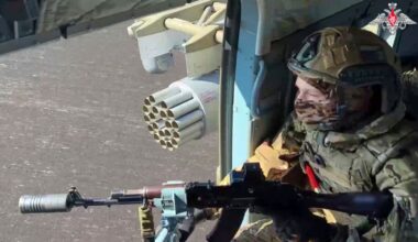 In this photo taken from video distributed by Russian Defense Ministry Press Service on Monday, May 19, 2025, A Russian Army soldier controls an area from a board of military helicopter in an undisclosed location in Ukraine. (Russian Defense Ministry Press Service via AP)