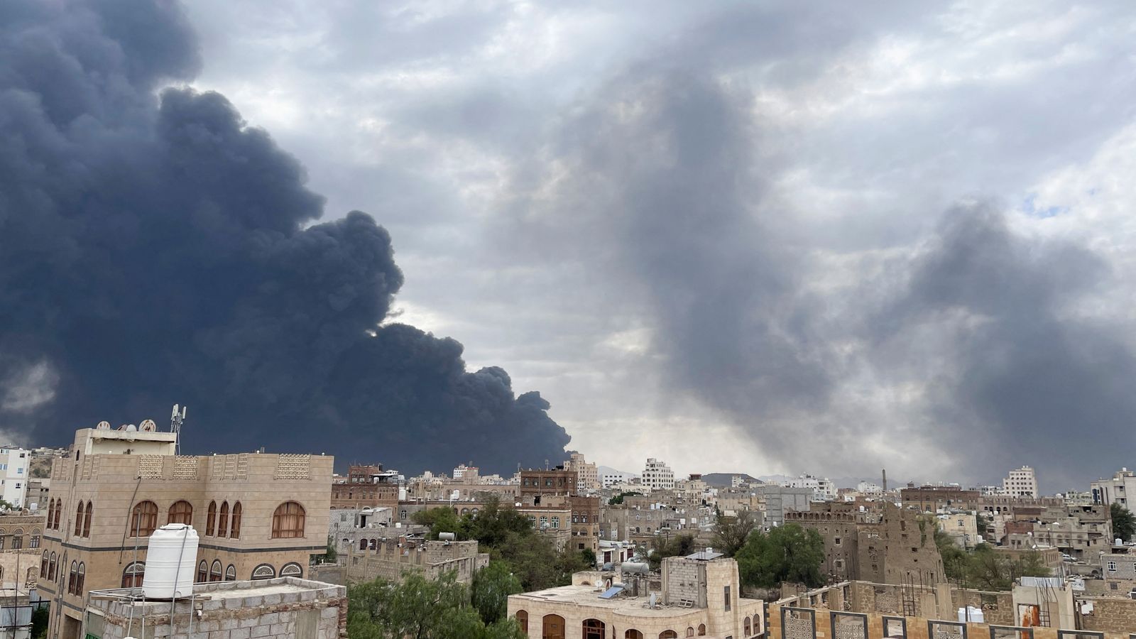 Smoke billows after Israel struck a power station and Sanaa International Airport, in Sanaa, Yemen. Pic: Reuters