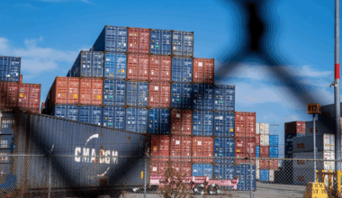 trade war, fence and shipping containers