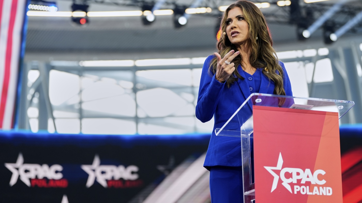 Noem urges Poles to elect Trump ally as CPAC holds its first meeting in Poland : NPR