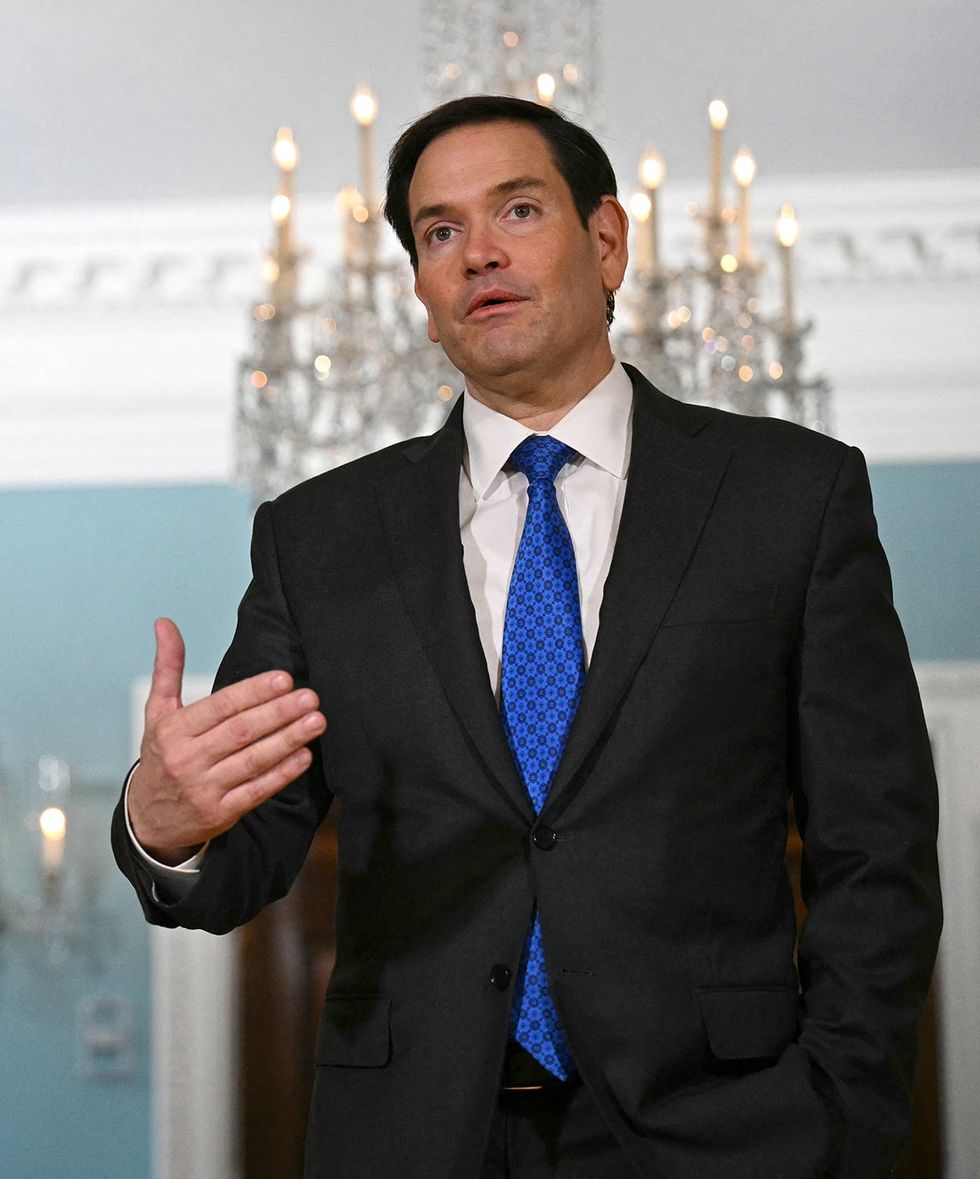 US Secretary of State Marco Rubio in a fancy room pointing to himself