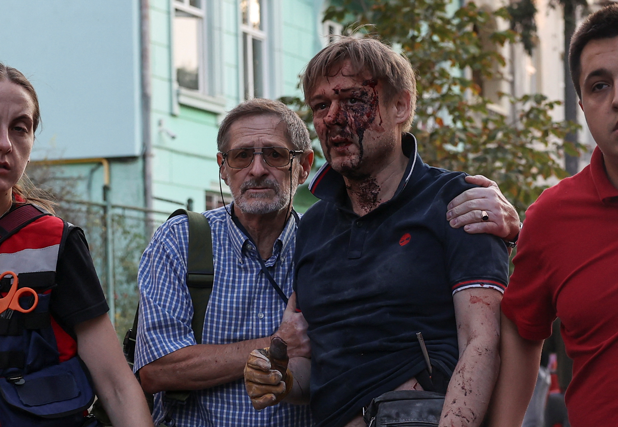 Injured man being helped by paramedics after a Russian drone and missile attack in Lviv, Ukraine.