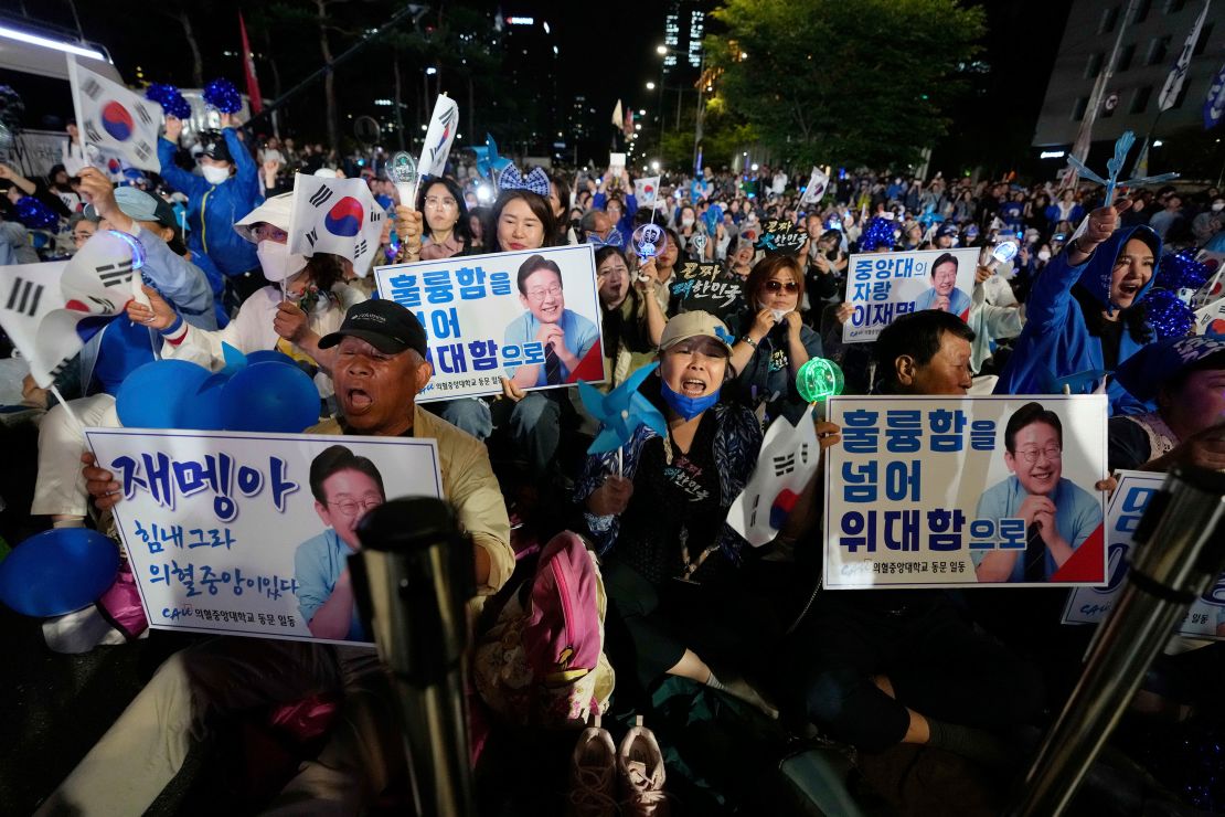 Supporters of Democratic Party candidate Lee Jae-myung react outside the National Assembly in Seoul, South Korea, on Tuesday.