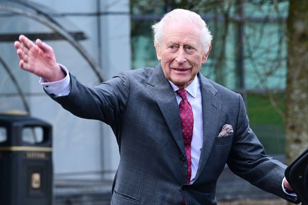 The king waving