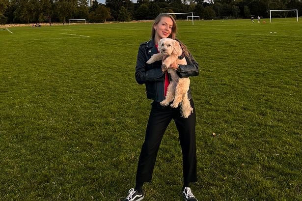 Andrea Oldereide holding a maltipoo in Regent's Park
