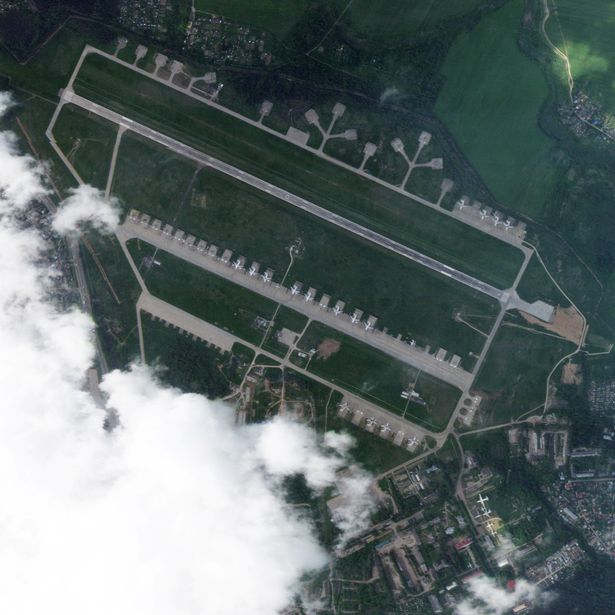 An aerial image of an air base surrounded by green fields.