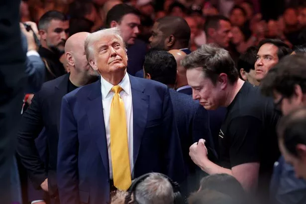 MIAMI, FLORIDA - APRIL 12: U.S. President Donald Trump prepares to watch the Ultimate Fighting Championship with Elon Musk at the Kaseya Center on April 12, 2025 in Miami, Florida. The Trump administration issued a rule late Friday that spared smartphones, computers, semiconductors, and other electronics from some of the tariffs they have enacted. (Photo by Joe Raedle/Getty Images)