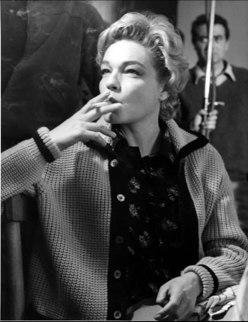 Simone Signoret smokes a cigarette while filming in Rome, Italy on 4 May 1960.