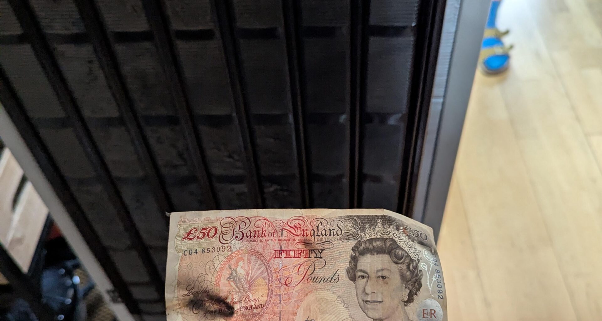 Fridge of at least 20 years is being replaced today. Pull it out to find an old £50 note at the back of it...