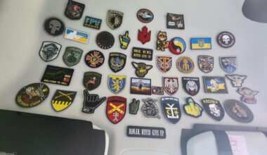 A coworker sends care packages to Ukraine. The soldiers send her their arm patches. This is her collection so far