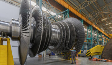 Decorative Photo: Assembly of a steam turbine rotor in a plant workshop.