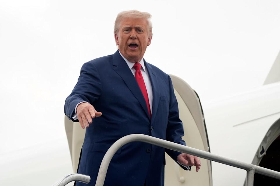 Trump boarded the plane on his way to Camp David (AP)