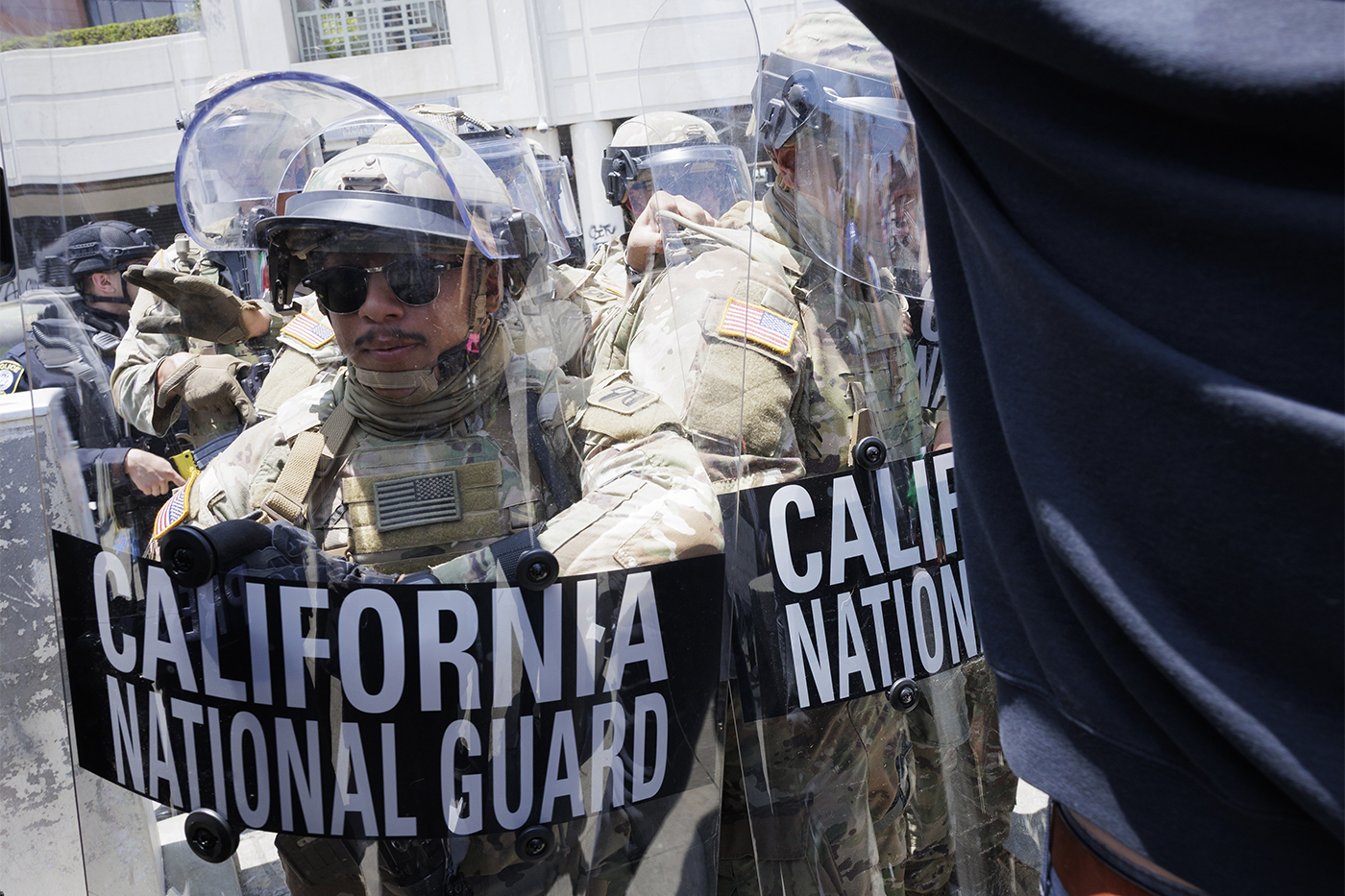 Federal law enforcement shown in tactical gear.