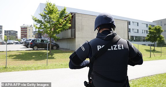 A policeman is seen close to a school where, according to reports, several people died in a shooting, on June 10, 2025 in Graz, southeastern Austria. Several people died in a school shooting, including the attacker, Austrian broadcaster ORF quoted the interior ministry as saying. (Photo by ERWIN SCHERIAU / APA / AFP) / Austria OUT (Photo by ERWIN SCHERIAU/APA/AFP via Getty Images)