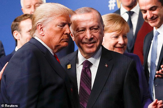 FILE PHOTO: U.S. President Donald Trump and Turkey's President Recep Tayyip Erdogan leave the stage after family photo during the annual NATO heads of government summit at the Grove Hotel in Watford, Britain December 4, 2019.  REUTERS/Peter Nicholls/Pool/File Photo