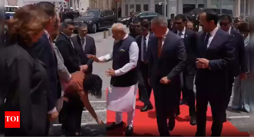 Watch: Nicosia council member touches Modi's feet - PM's Cyprus visit | India News