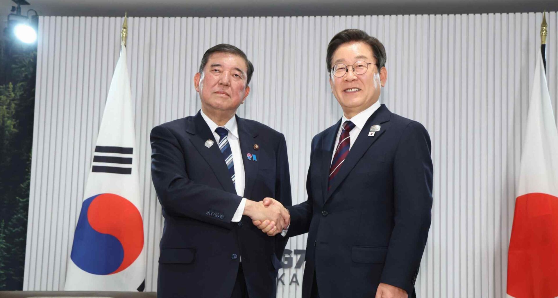 Japan, South Korea leaders vow to boost ties in 1st in-person meeting
