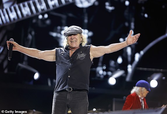 14831697 Huge sign AC/DC is set to announce an Australian tour after rumours the rock band would return to home turf - and what city will be their first stop? NASHVILLE, TENNESSEE - MAY 21: Brian Johnson and Angus Young of AC/DC perform during the Power Up tour at Nissan Stadium on May 21, 2025 in Nashville, Tennessee. (Photo by Tibrina Hobson/Getty Images)