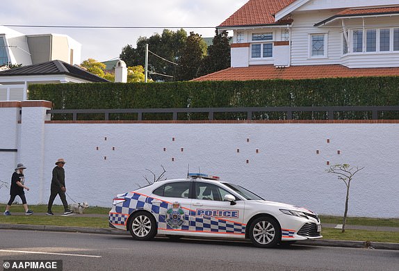 Police are seen at a house in Clayfield, Brisbane, Friday, June 27, 2025. A man who was stabbed to death is believed to have known his attacker, a 15-year-old boy, according to Queensland Police. (AAP Image/Fraser Barton) NO ARCHIVING, IMAGE TAKEN BY JOURNALIST 14852209
