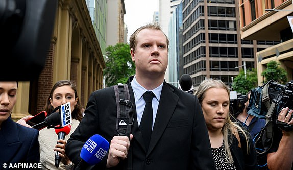Kristian White (centre) departs the Supreme Court of New South Wales in Sydney, Friday, November 29, 2024. Constable Kristian James White, who fatally tasered a 95-year-old woman, has been found guilty of manslaughter after a jury rejected claims he acted lawfully. (AAP Image/Bianca De Marchi) NO ARCHIVING 14160361