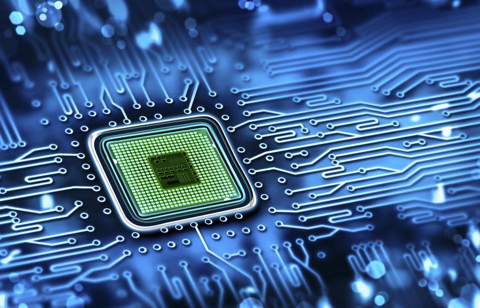Green microchip set in a blue printed circuit board