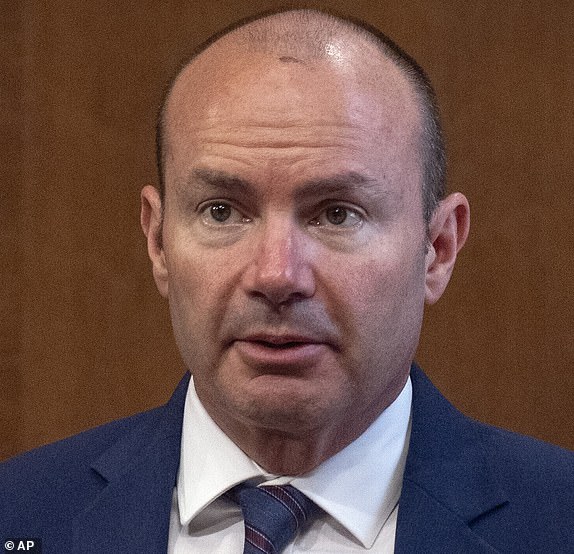 Energy Secretary Chris Wright, right, talks with Sen. Mike Lee, R-Utah, left, before a hearing of the Senate Committee on Energy and Natural Resources on Capitol Hill, Wednesday, June 18, 2025, in Washington. (AP Photo/Mark Schiefelbein)