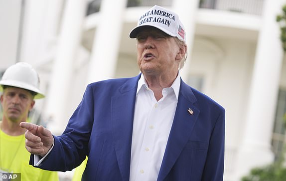 President Donald Trump speaks as a flag pole is installed on the South Lawn of the White House, Wednesday, June 18, 2025, in Washington. (AP Photo/Evan Vucci)