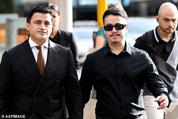 Ahmad Rashad Nadir (right) arrives at the Downing Centre Local Court, Sydney, Wednesday, March 19, 2025. Two nurses have been charged over comments made in a video chat with an Israeli influencer. (AAP Image/Bianca De Marchi) NO ARCHIVING