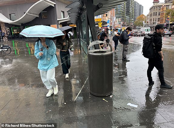 Mandatory Credit: Photo by Richard Milnes/Shutterstock (15314363g) People at the bus stops outside Central Station during rainy weather. Wet weather continues in Sydney, Australia, George Street, NSW - 22 May 2025 14771453 14858951