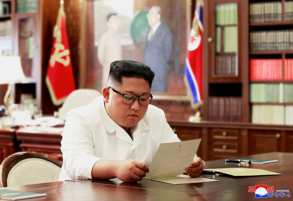 North Korean leader Kim Jong-un reads a letter from US President Donald Trump in June 2019. Photo: KCNA/KNA/AFP North Korean leader Kim Jong-un reads a letter from US President Donald Trump in June 2019. Photo: KCNA/KNA/AFP