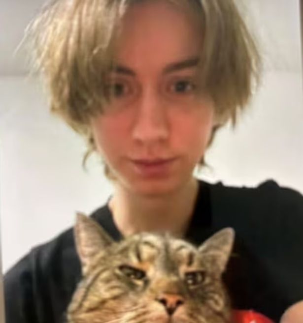 A photo of Artur A holding a cat