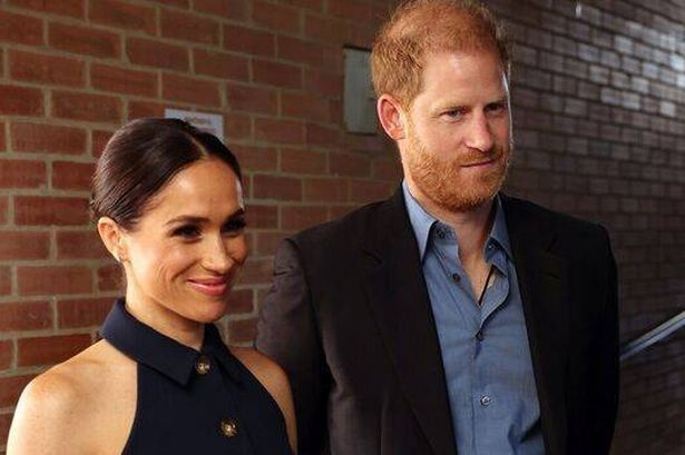 Harry and Meghan smiling