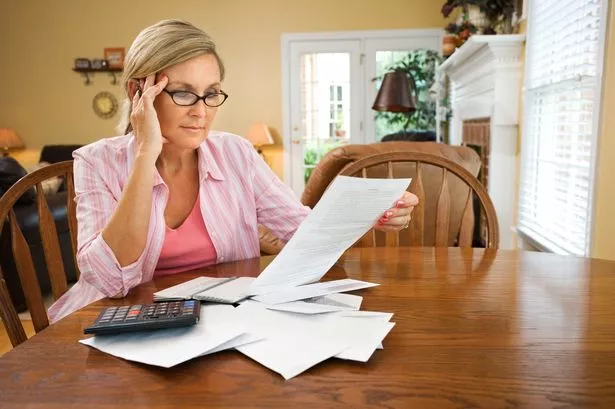 Woman planning finances, generic
