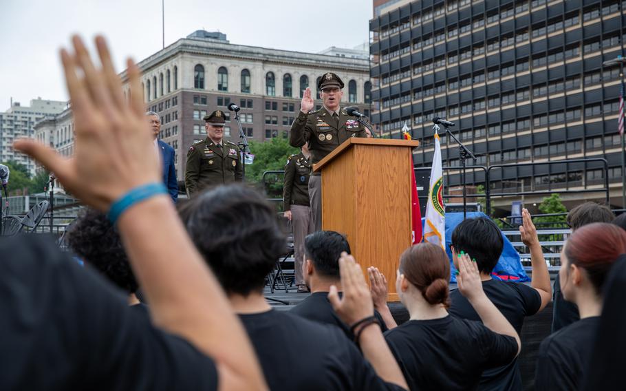 A man speaks at a military ceremony.
