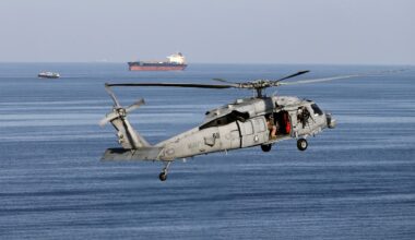 Strait of Hormuz tankers and a military helicopter