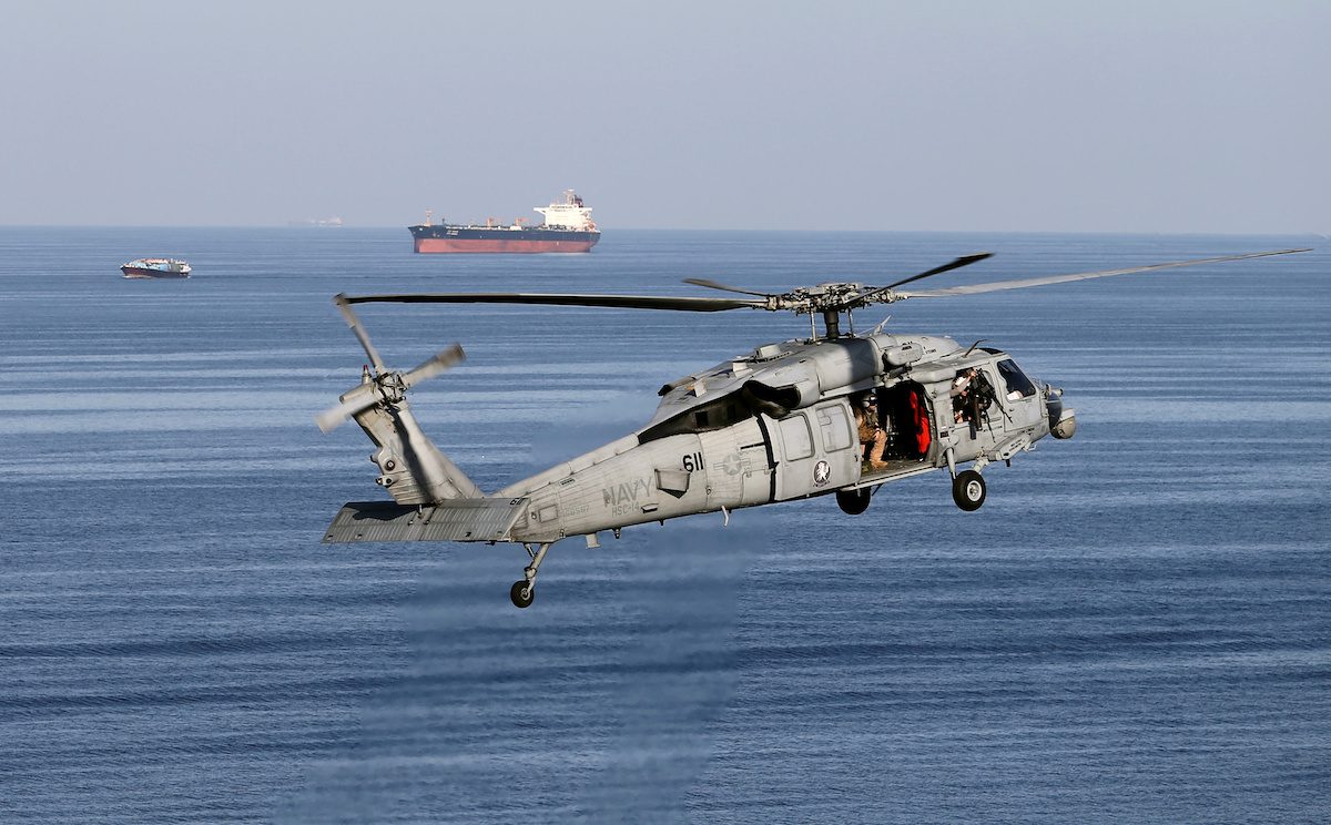Strait of Hormuz tankers and a military helicopter
