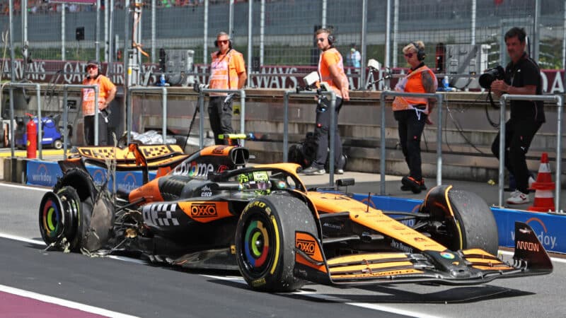 Lando Norris (McLaren-Mercedes) in the pits with a damaged tyre during the 2024 Austrian Grand Prix