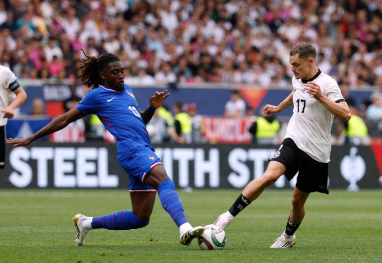 France's Manu Kone in action with Germany's Florian Wirtz
