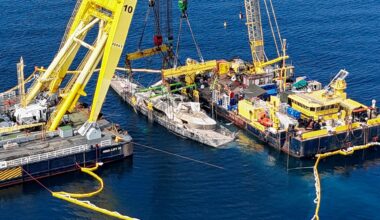 A drone view shows floating crane ships HEBO LIFT 10 and HEBO LIFT 2 recovering the "Bayesian" yacht of British tech entrepreneur Mike Lynch