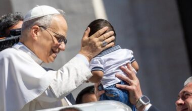 Pope Leo XIV blesses a baby at his May 28, 2025, general audience.