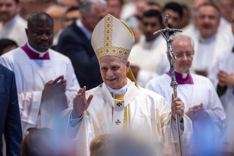 Pope Leo XIV waves to those gathered for Mass for the Jubilee of Sport on the Solemnity of the Most Holy Trinity on June 15, 2025, in St. Peter’s Basilica at the Vatican.